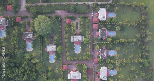 Bird's Eye View Of Villas With Pools In Idyllic Summer Resort Of The LaLiT Golf And Spa Resort Goa, India - aerial drone shot photo