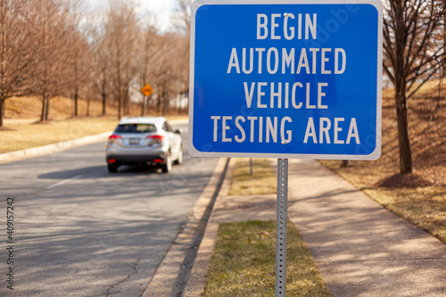 Close up isolated image of a road sign near Washington DC that says: Begin Automated Vehicle Testing Area. This is one of the few spots in US where self driving cars are tested for safety. © Grandbrothers