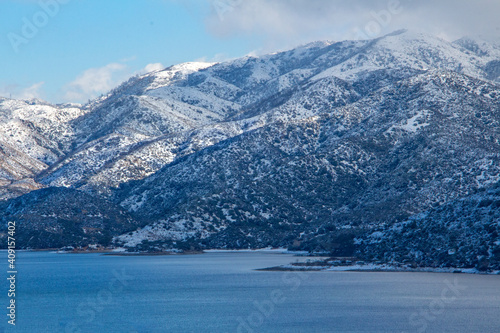 Misty mountain lake on a snowy day