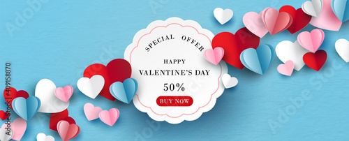 Colorful hearts with white banner and space for texts in paper cut style on blue paper pattern background.