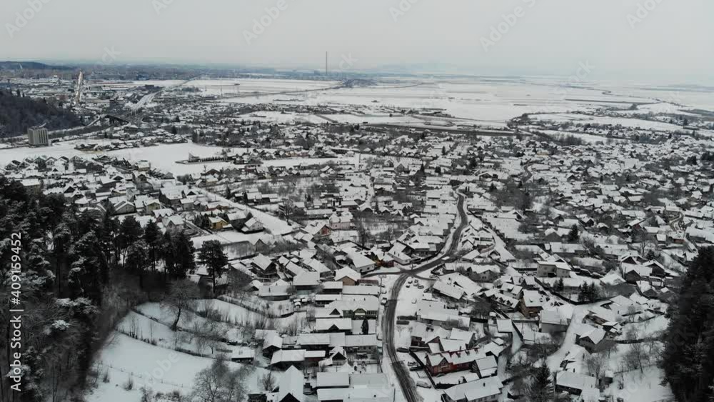 Aerial view of Sacele, Baciu covered with snow on a winter cloudy day Aerial view of Sacele, Baciu covered with snow on a winter cloudy day