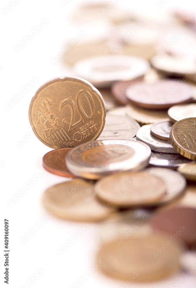 Coins of different countries on a white background.