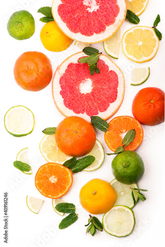 Citrus background. Fresh citrus fruits - Lemons, oranges, limes, grapefruits on the white background