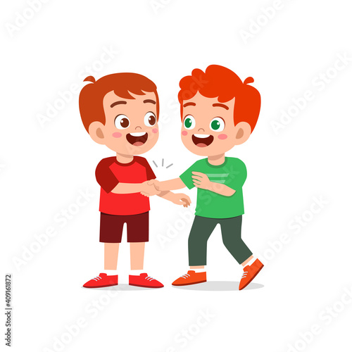 cute little kid boy do hand shake with his friend