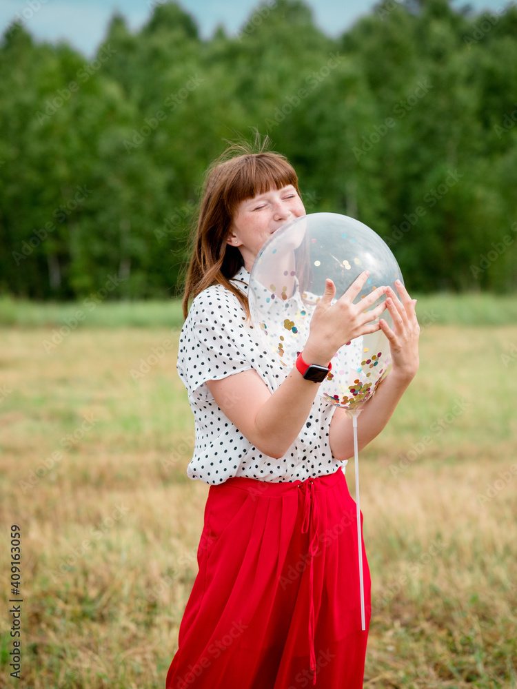 Girl in a field with a balloon Girl in a field with a balloon