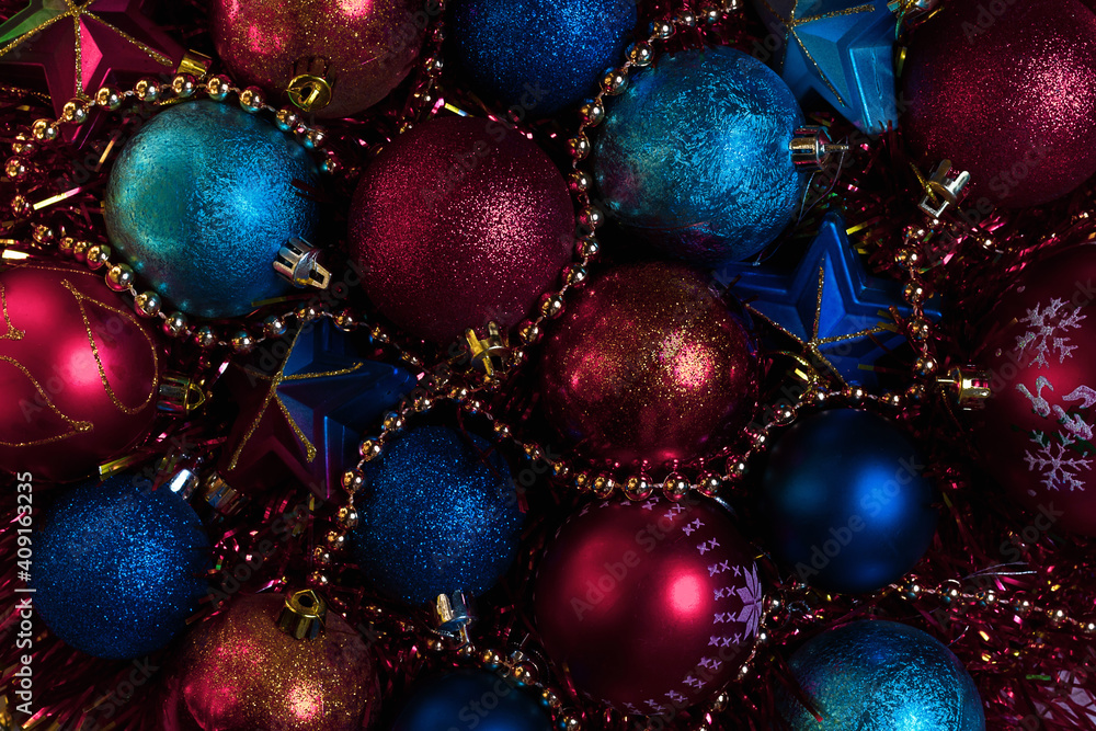 Amazing Christmas composition with blue and red christmas balls. Christmas or New Year concept. Dark festive background with baubles. Top view. Amazing Christmas composition with blue and red christmas balls. Christmas or New Year concept. Dark festive background with baubles. Top view.