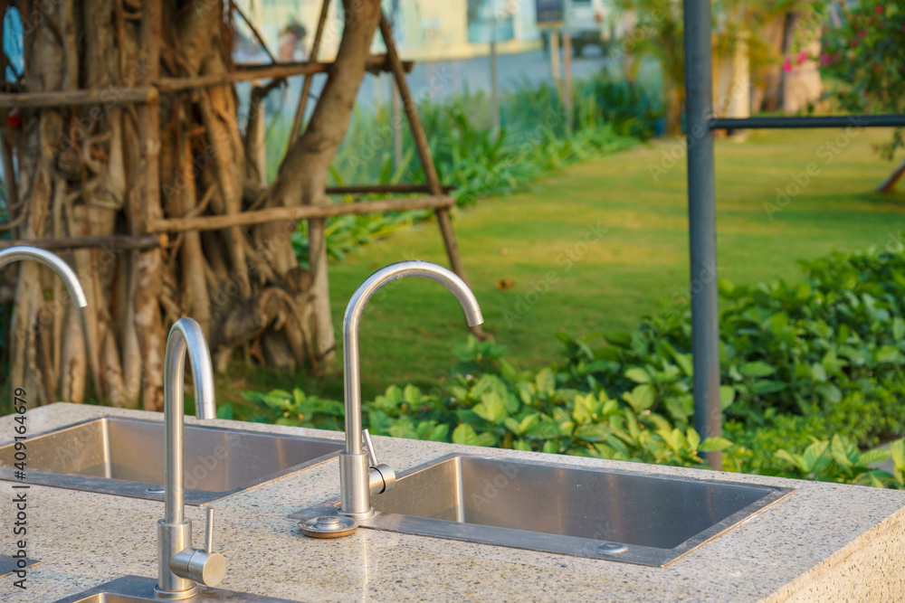 Outdoor faucet and sink for bbq in the garden Outdoor faucet and sink for bbq in the garden