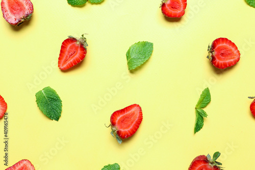 Fototapeta Naklejka Na Ścianę i Meble -  Cut strawberry and mint on color background