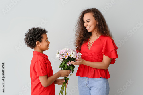 African-American boy greeti...