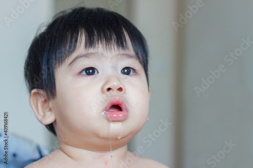 Asian baby drooling isolated on white background