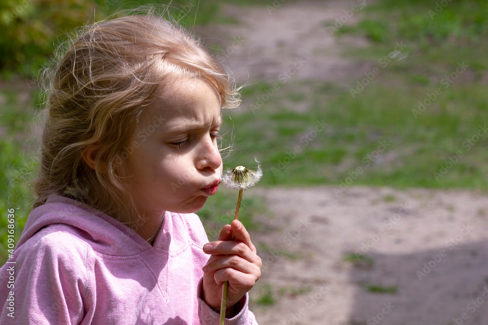 happy little girls blowing seeds from dandelion in lockdown forest happy little girls blowing seeds from dandelion in lockdown forest