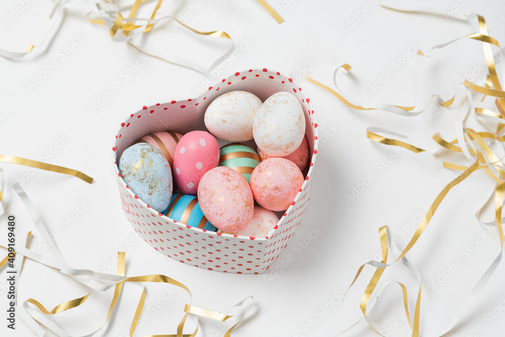 Fototapeta premium Easter eggs in pastel colors in heart shaped box. Happy Easter