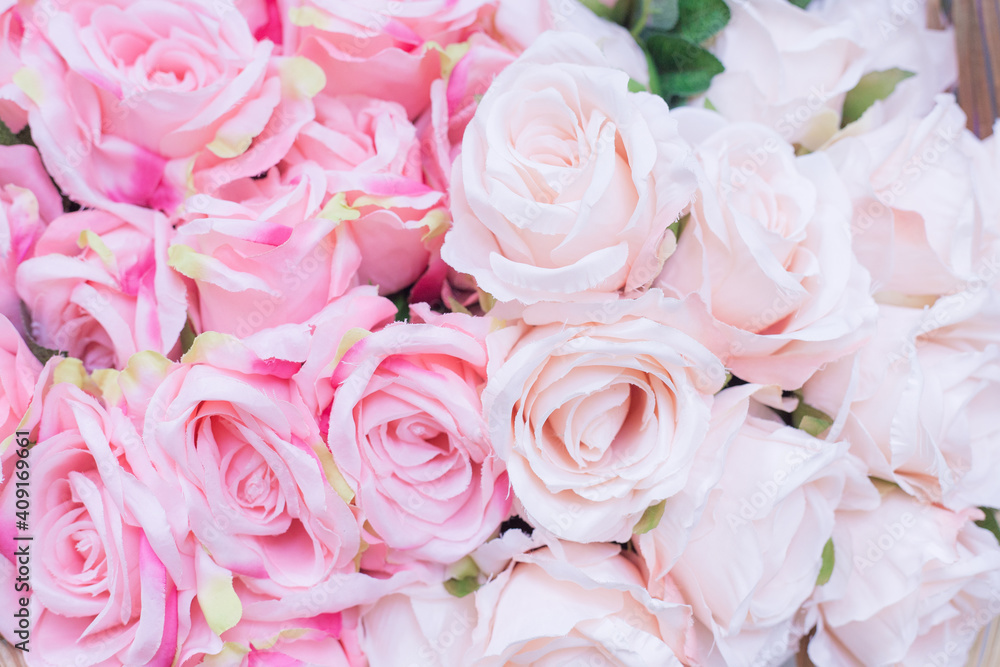 Close up of many fabric pale pink roses with blurred background. Close up of many fabric pale pink roses with blurred background.