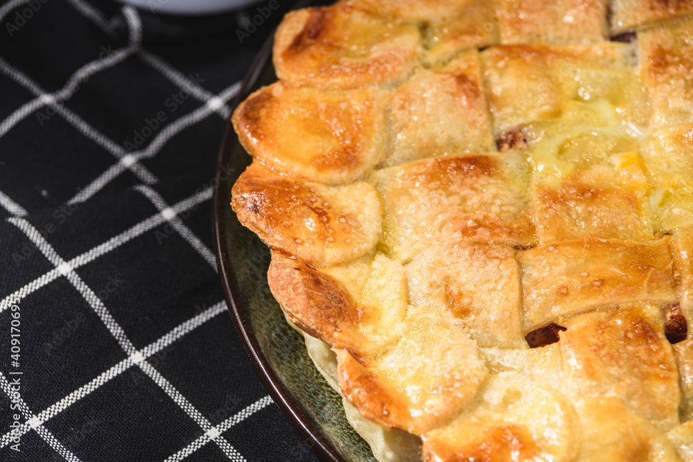 apple pie on a wooden background. Rustic style. apple pie on a wooden background. Rustic style.