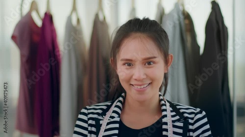 Head shot portrait Fashion designer Asian woman happy smiling looking into the camera working focused concentrated innovation creative design idea at home office online clothing store ecommerce