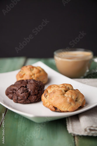 Cookies on a white plate with coffee latte