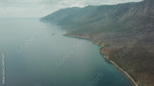 Drone video. Summer. Lake. The mountains. Sandy bay
