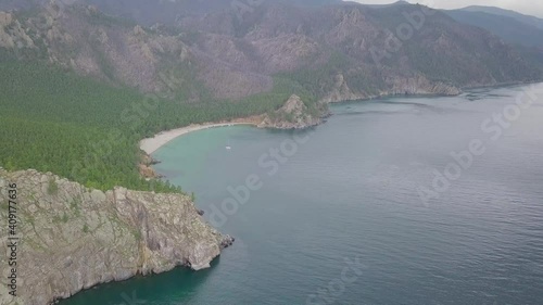 Drone video. Summer. Lake. The mountains. Sandy bay