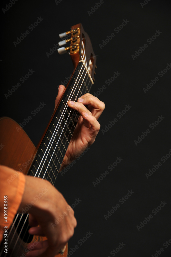Close up of an acoustic guitar being played Close up of an acoustic guitar being played
