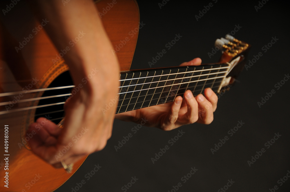 Obraz premium Close up of an acoustic guitar being played