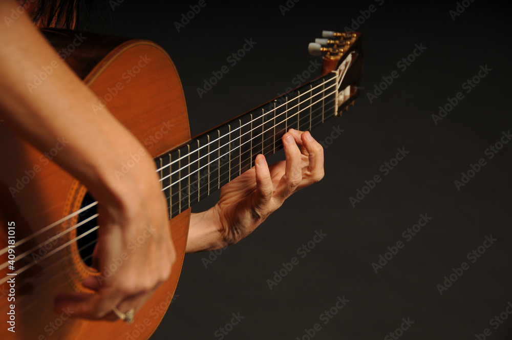 Obraz premium Close up of an acoustic guitar being played