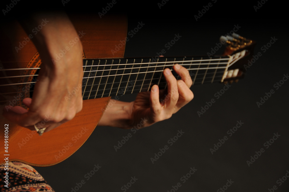 Fototapeta premium Close up of an acoustic guitar being played