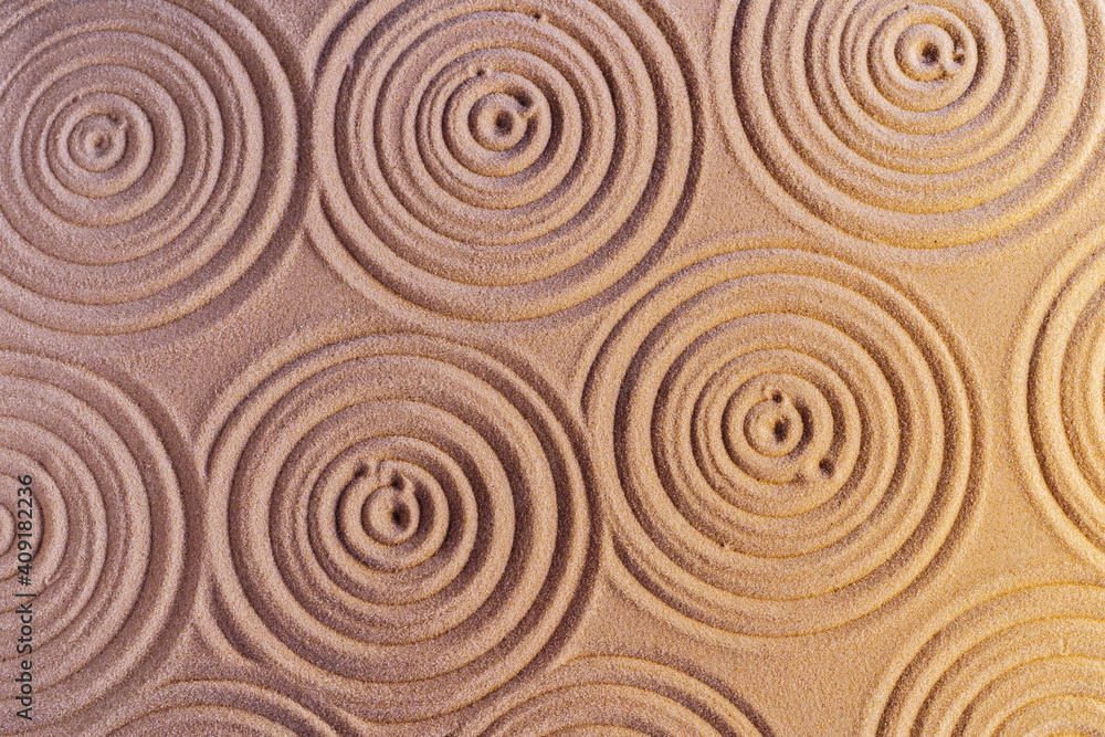 Ornaments on sand in japanese zen garden