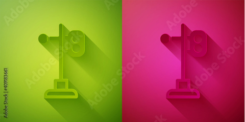 Paper cut Train traffic light icon isolated on green and pink background. Traffic lights for the railway to regulate the movement of trains. Paper art style. Vector.
