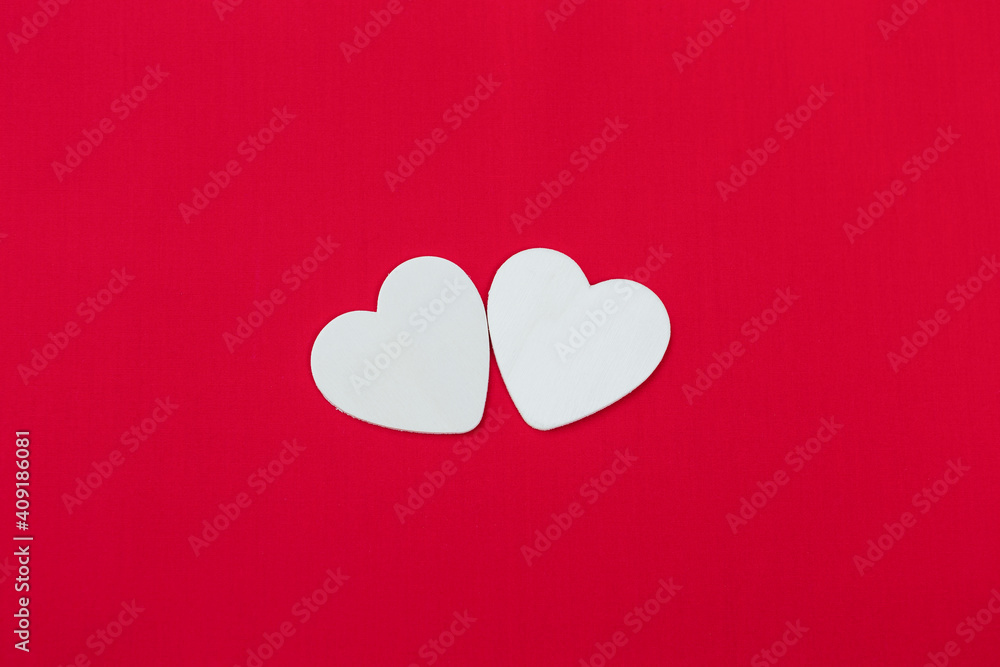White wooden heart on red fabric texture background, love and romance concept, valentine card background idea