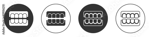 Black False jaw icon isolated on white background. Dental jaw or dentures, false teeth with incisors. Circle button. Vector.