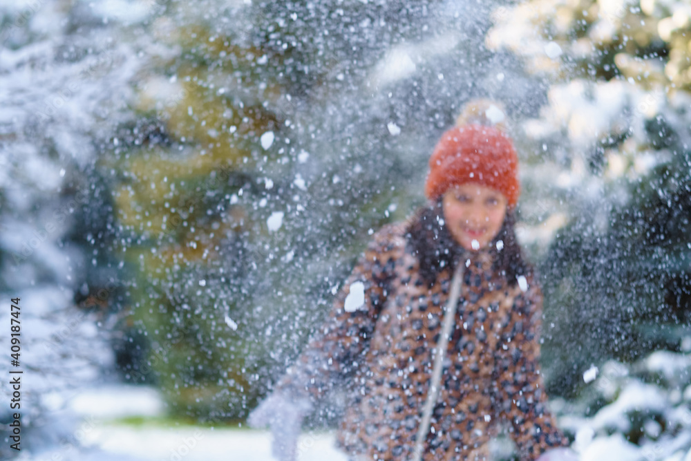 child girl throws up snow and playing in the winter forest, bright snowy fir trees, beautiful nature child girl throws up snow and playing in the winter forest, bright snowy fir trees, beautiful nature