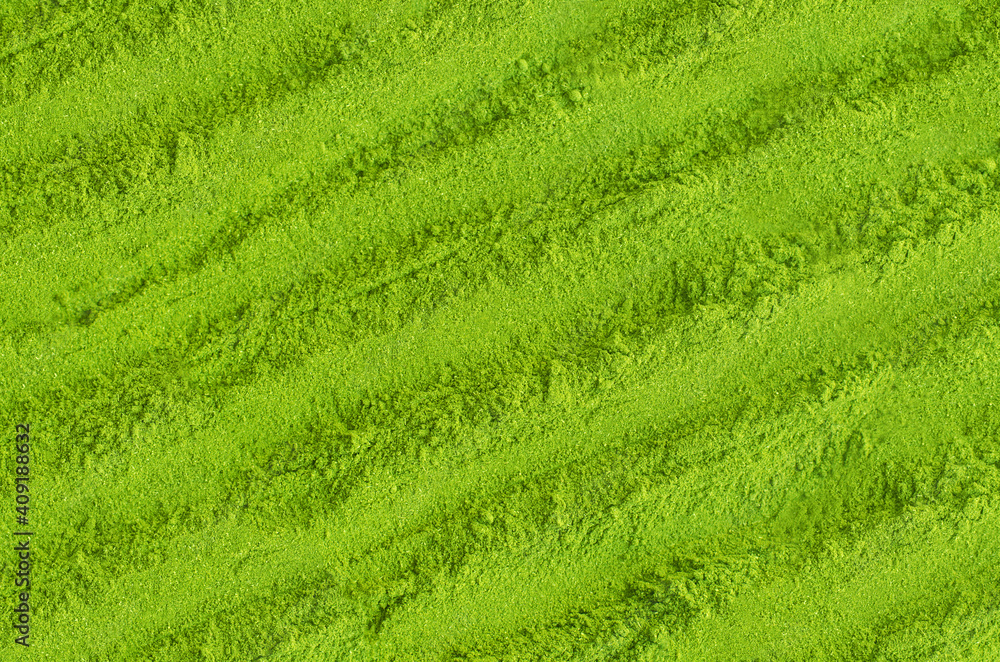 Matcha powder background. Green tea texture close up, selective focus Matcha powder background. Green tea texture close up, selective focus