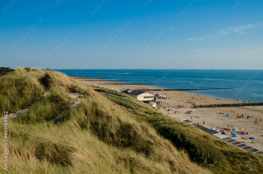 Westkapelle, The Netherlands, August 2019. The beaches of this location are wide and clean: on a beautiful sunny summer day a lot of people enjoy the sea.