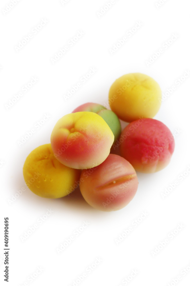 Traditional Italian Marzipan fruits isolated on white background. Sweet Marzipan shaped like fruits from Sicily