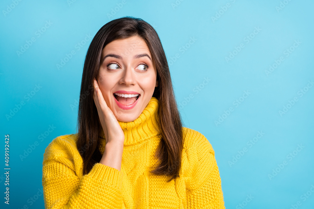 Close-up portrait of charming cheerful amazed girl looking aside copy empty space news wow isolated over bright blue color background Close-up portrait of charming cheerful amazed girl looking aside copy empty space news wow isolated over bright blue color background