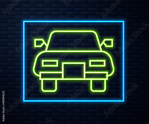 Glowing neon line Car icon isolated on brick wall background. Vector.