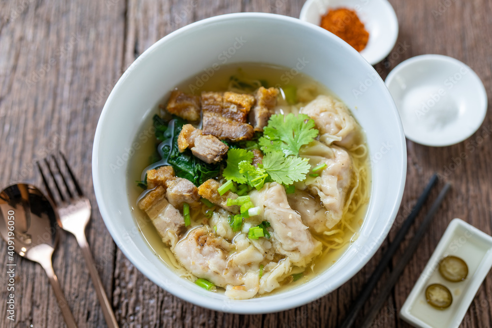 Wonton Noodles Soup with fish balls, Crispy pork, and special homemade Soup. Thai noodles soup.