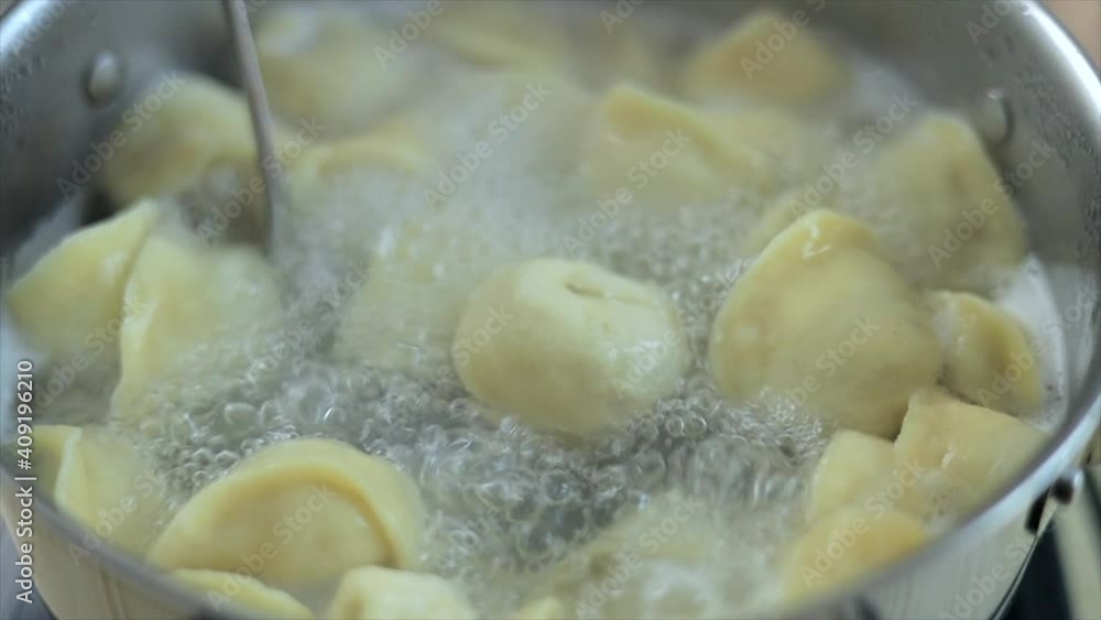 Close-up view on ravioli cooking in boiling water Close-up view on ravioli cooking in boiling water