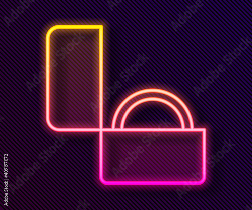 Glowing neon line Diamond engagement ring icon isolated on black background. Vector.