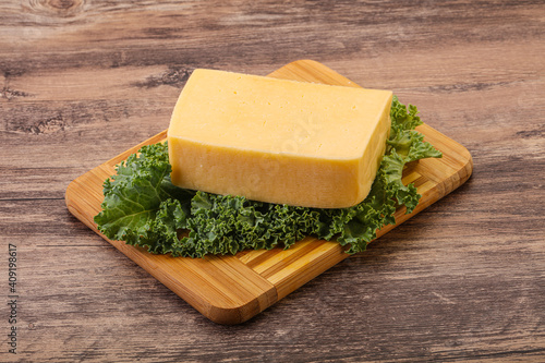 Tasty yelloow Tilsiter cheese brick