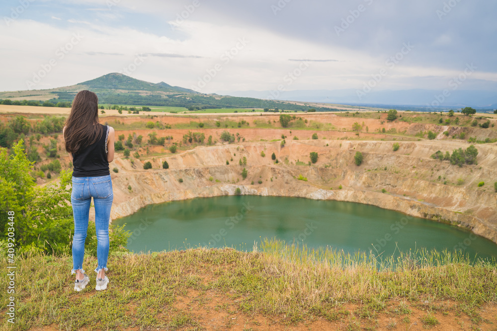 Woman in font of copper mine with copy space Woman in font of copper mine with copy space