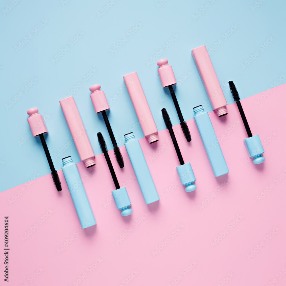 Set of professional mascara on pastel pink and blue background with copy space for text. Minimal make up, beauty, fashion, party and shopping concept. Cosmetic or beauty salon layout. Flat lay. Set of professional mascara on pastel pink and blue background with copy space for text. Minimal make up, beauty, fashion, party and shopping concept. Cosmetic or beauty salon layout. Flat lay.