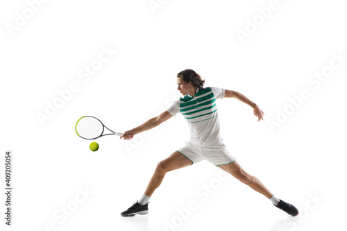 Excited. Young caucasian professional sportsman playing tennis isolated on white background. Training, practicing in motion, action. Power and energy. Movement, ad, sport, healthy lifestyle concept. © master1305