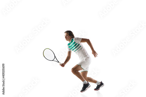 Catching. Young caucasian professional sportsman playing tennis isolated on white background. Training, practicing in motion, action. Power and energy. Movement, ad, sport, healthy lifestyle concept.