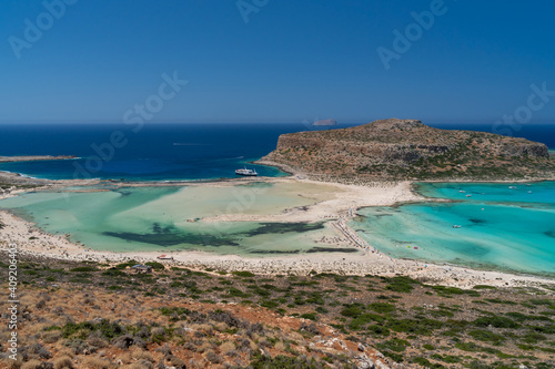 Amazing Panoramic view of Balos Lagoon near Chania, with magical turquoise waters, lagoons, tropical beaches of pure white, pink sand and Gramvousa island on Crete, fantastic vivd colors. Greece