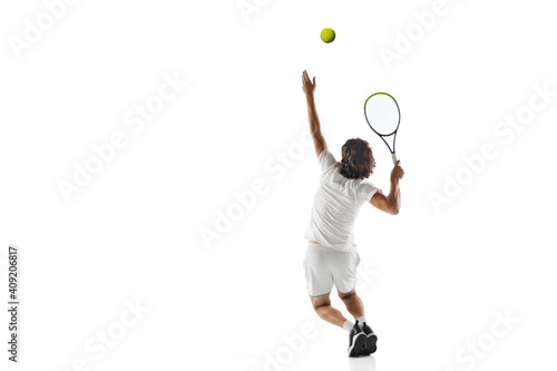 Speed. Young caucasian professional sportsman playing tennis isolated on white background. Training, practicing in motion, action. Power and energy. Movement, ad, sport, healthy lifestyle concept. © master1305