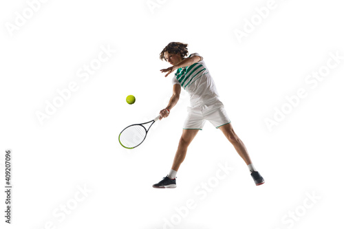 Flying. Young caucasian professional sportsman playing tennis isolated on white background. Training, practicing in motion, action. Power and energy. Movement, ad, sport, healthy lifestyle concept. © master1305
