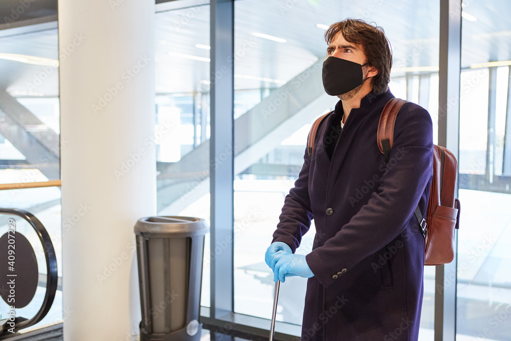 Business traveler with face mask at the airport Stock Photo Adobe Stock