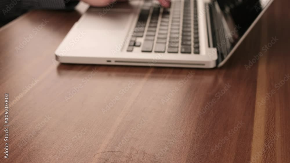 Man Drinking Coffee While Typing on Laptop Man Drinking Coffee While Typing on Laptop