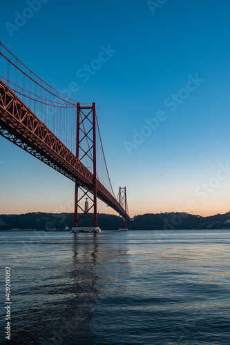 Fototapeta Naklejka Na Ścianę i Meble -  Panorama view over the 25 de Abril Bridge. The bridge is connecting the city of Lisbon to the municipality of Almada on the left bank of the Tejo river, Lisbon